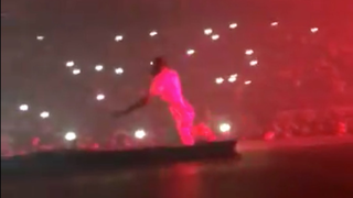 Here's Travis Scott Falling Through A Hole In The Stage At The Drake Show